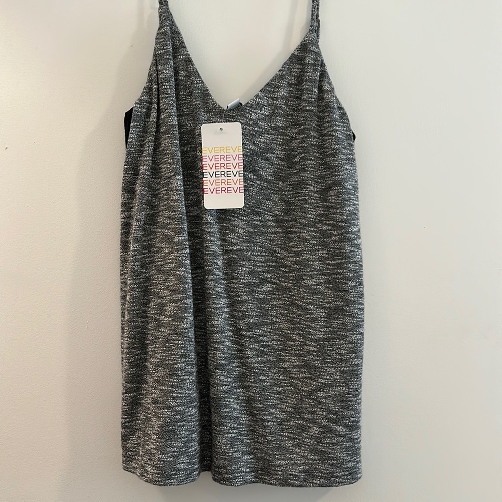 Brand New! Grey dressy tank top, with black sides. Size XS, fit it flowy